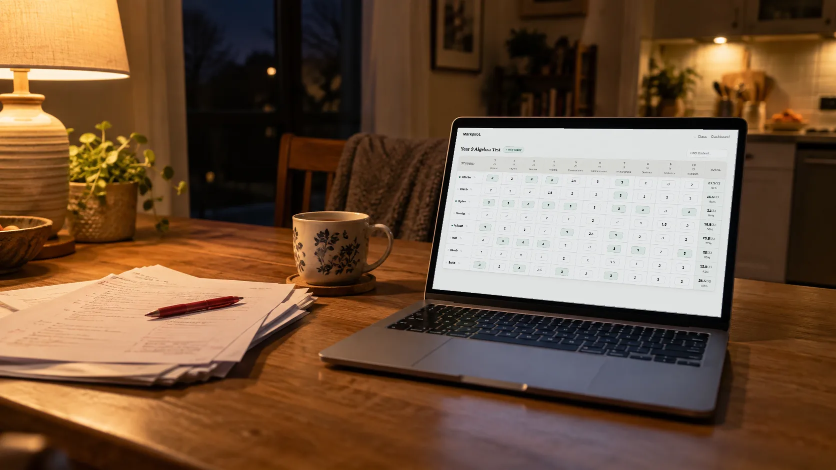 A markbook on a laptop at home in the evening